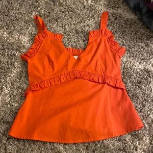 never a wall flower tank top more of a red orange